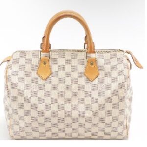 Louis Vuitton Speedy 30 handbag is featured in the iconic Damier Azur w insert